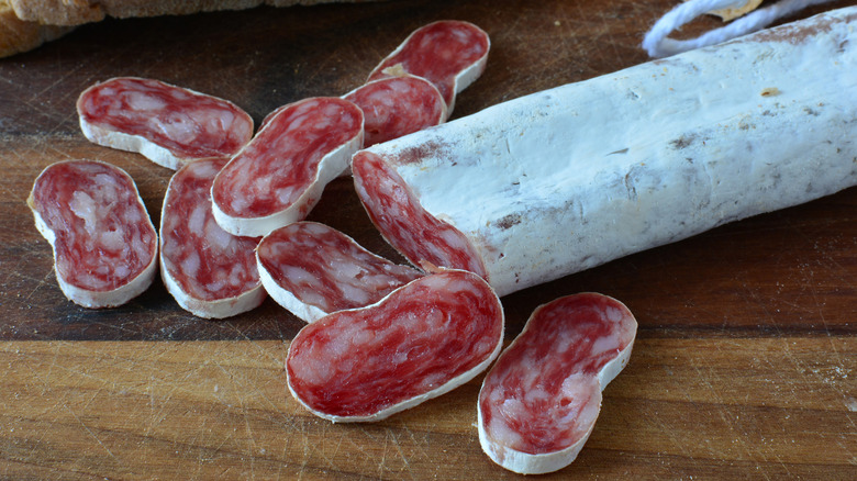 Salami slices on cutting board