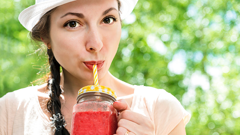 Woman drinking cranberry juice