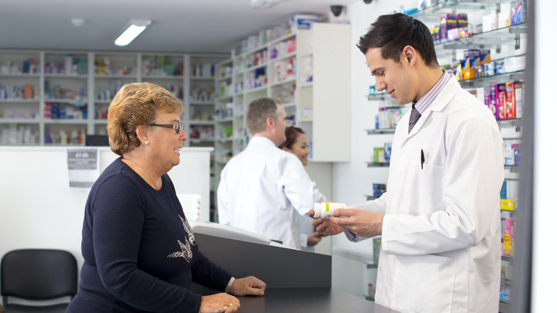 Customers at pharmacy counter