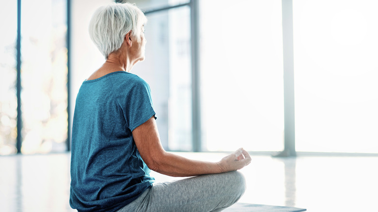 Woman sitting up straight in yoga pose