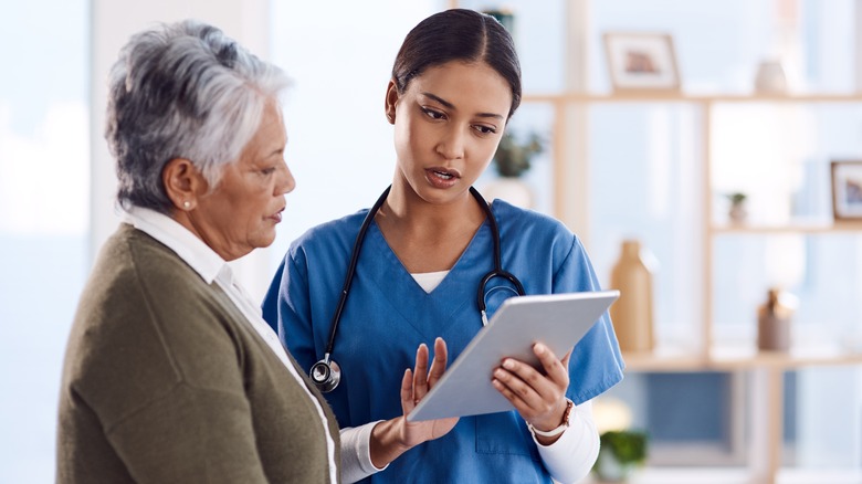 Healthcare provider showing patient chart