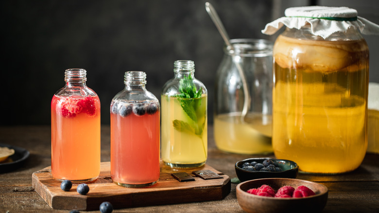 several bottles of homemade kombucha on a table