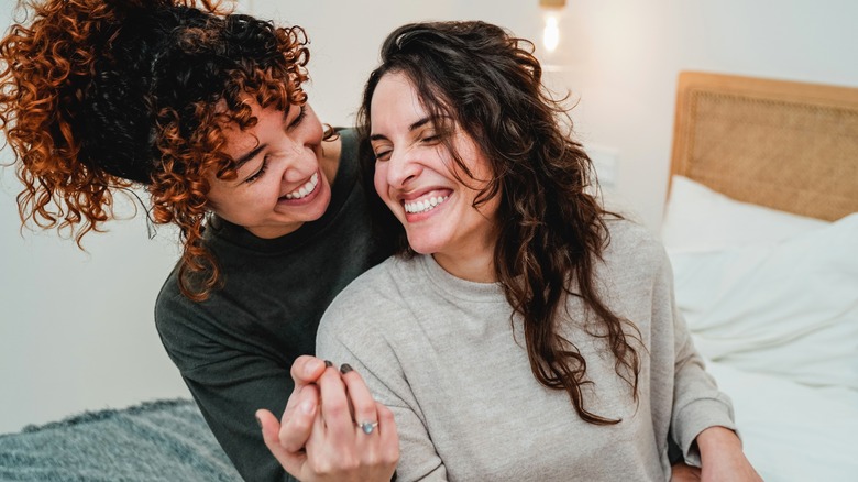 happy gay couple smiling 