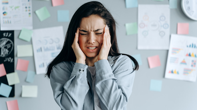 Woman holding her head