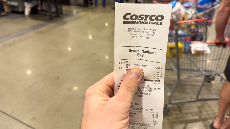 hand holding Costco food court receipt