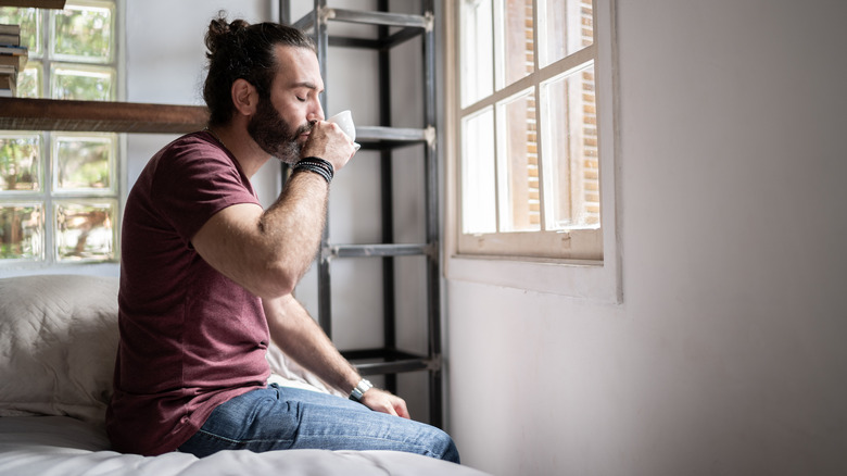 Man drinking from mug