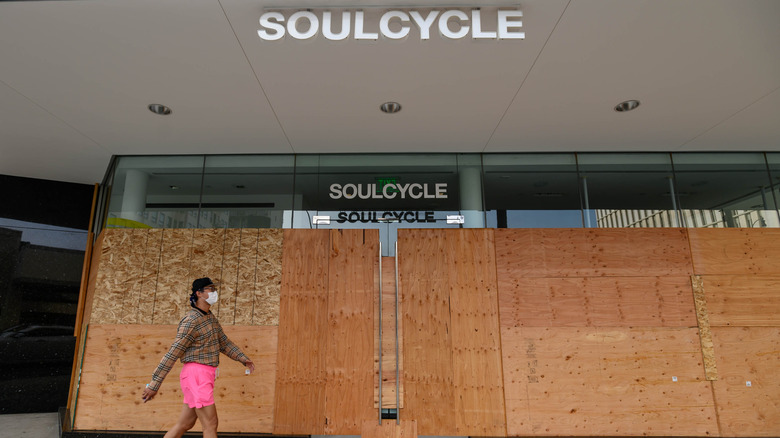 The boarded up façade of a SoulCycle 