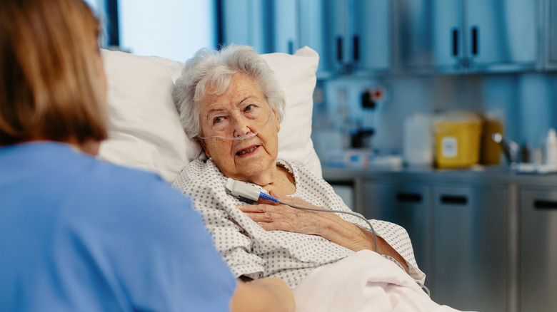 An older woman in a hospital bed