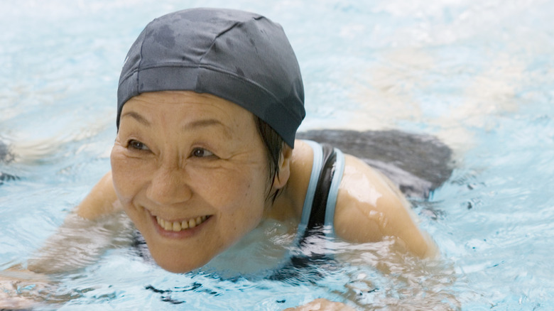 happy older woman swimming