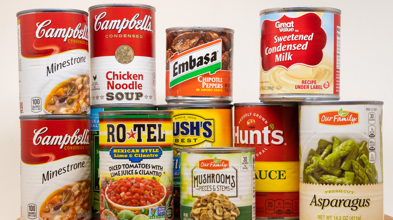 stack of canned goods on shelf