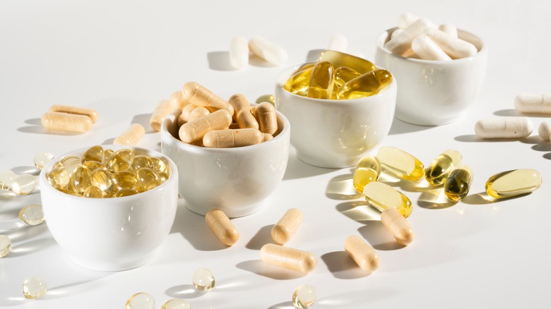 Vitamins in bowls on table