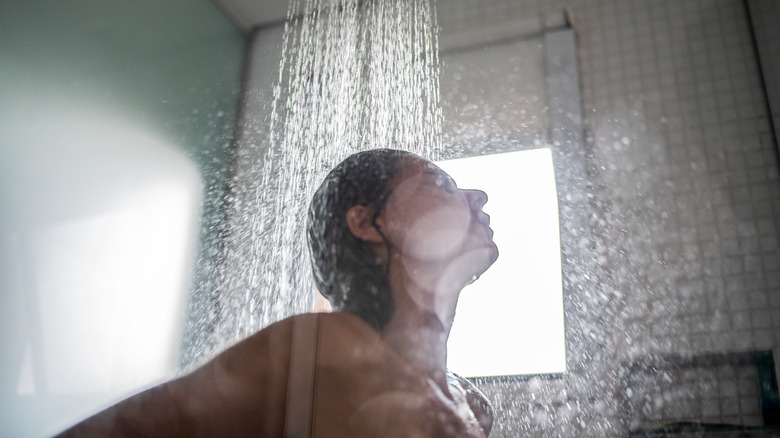 Woman rinsing hair