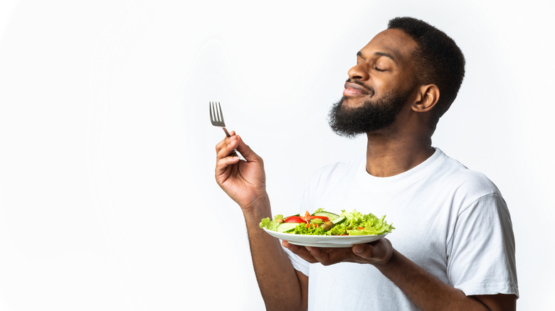 Man eating salad