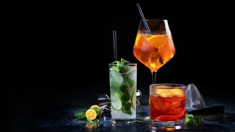 Three cocktails against a black background