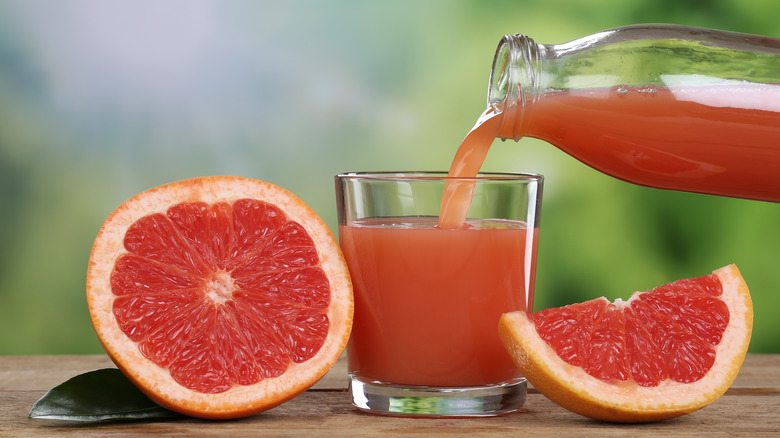 Grapefruit juice being poured into a glass