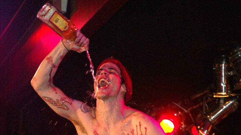 Steve-O pouring liquor into his mouth