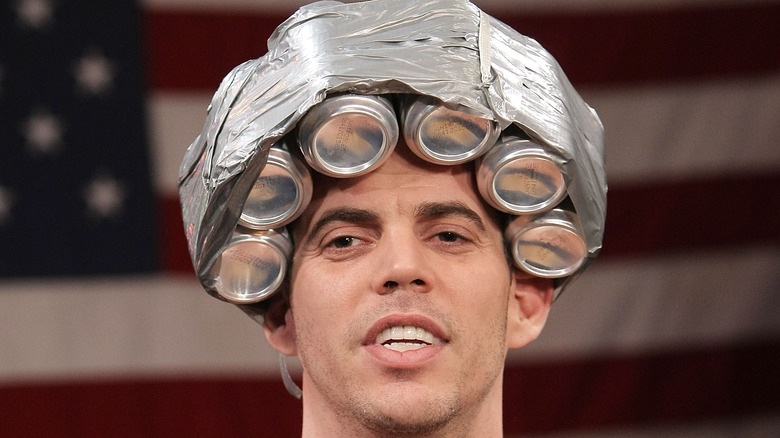 Steve-o with beer cans on his head