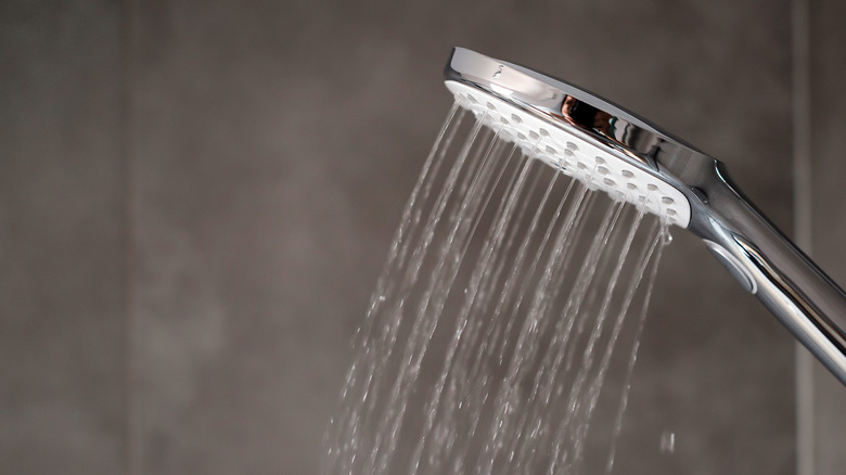 A shower head with flowing water