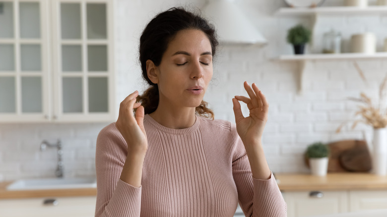 Woman breathing out