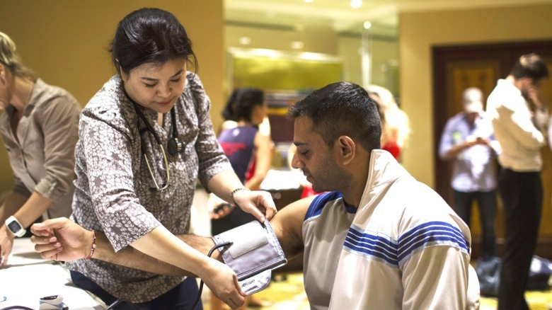 man getting blood pressure taken