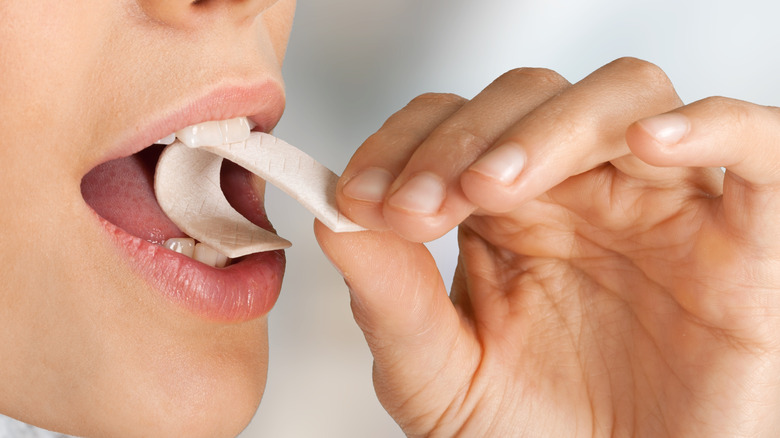 Person consuming chewing gum