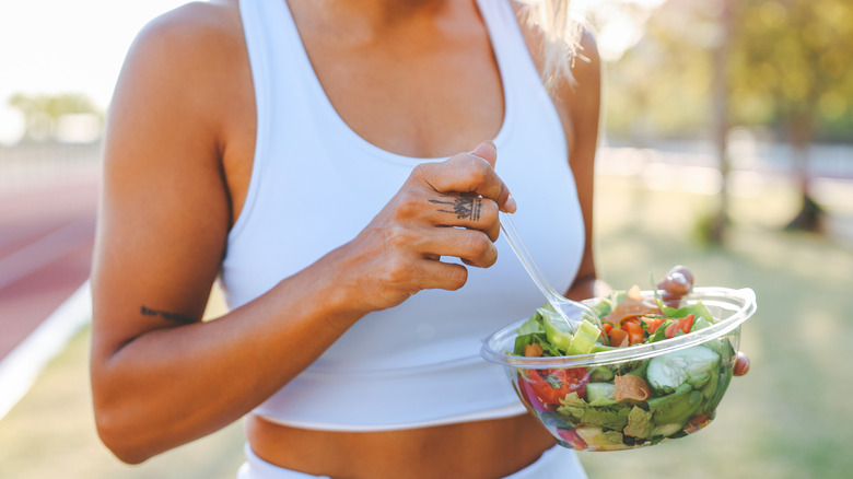 woman eating healthy after training