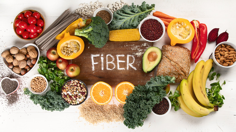 Top view display of high fiber foods with the word "fiber" in the middle