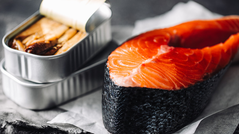 canned salmon next to raw salmon steak