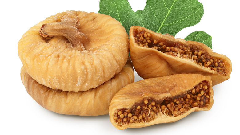 Dried figs on white background