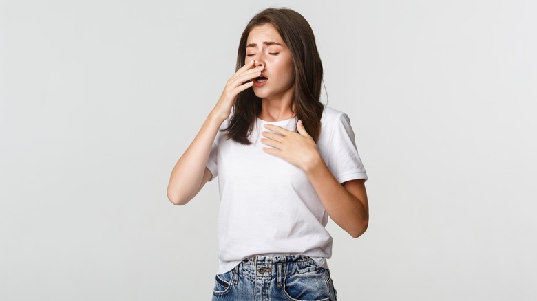 woman sneezing 