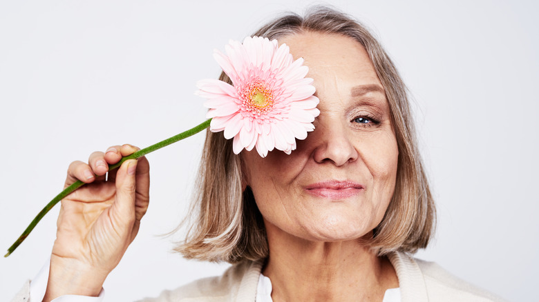menopausal woman with flower