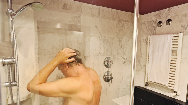 Older man showering