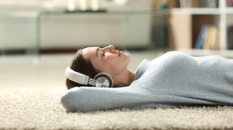 woman lying on carpet