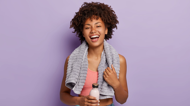 Woman with a towel around her neck