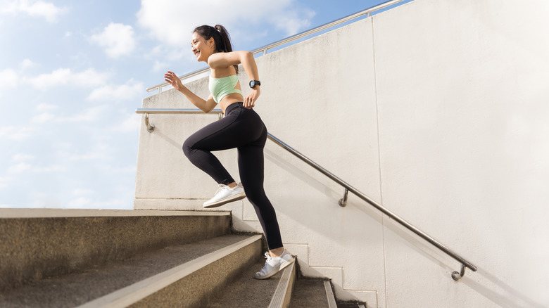 Woman exercising on stairs