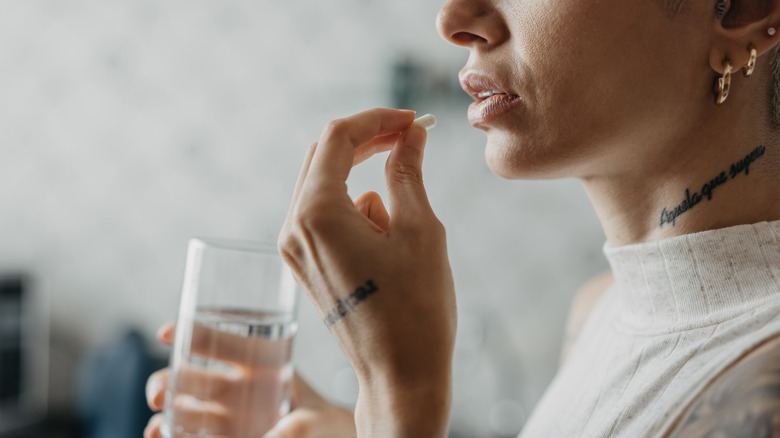 Woman taking medication