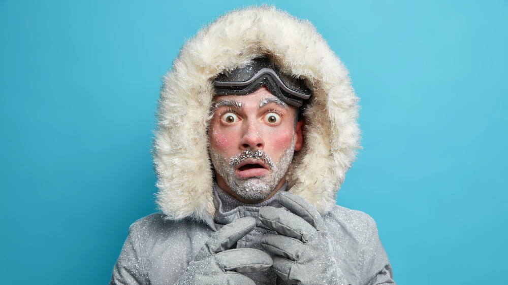 Cold man in jacket, covered in ice