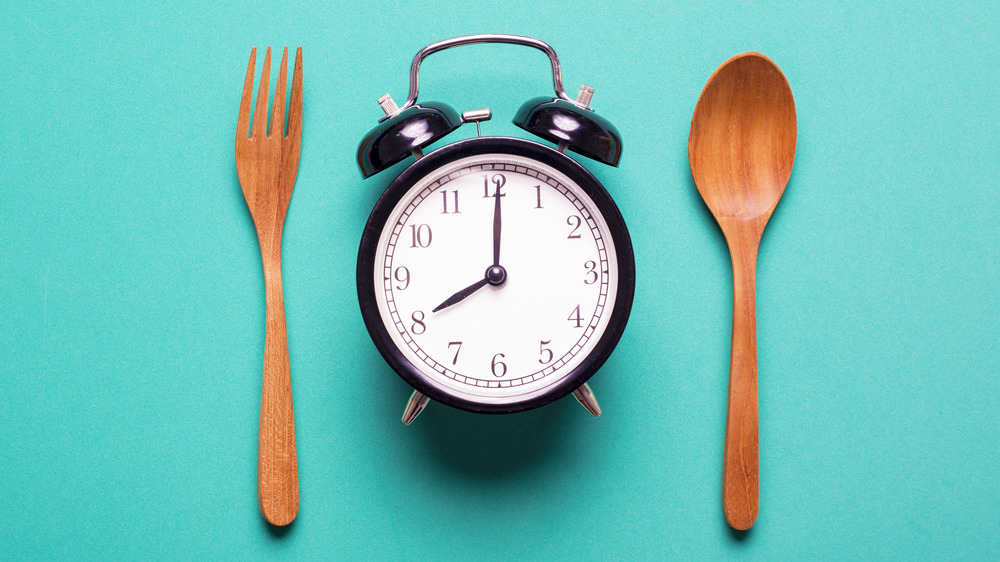 alarm clock, spoon, fork