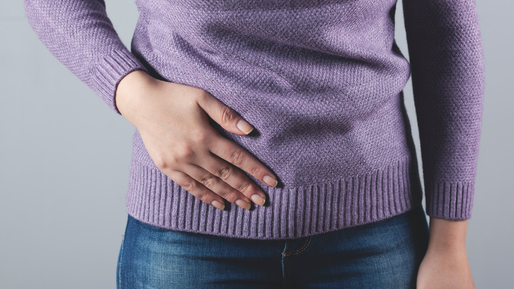 Woman holding appendix