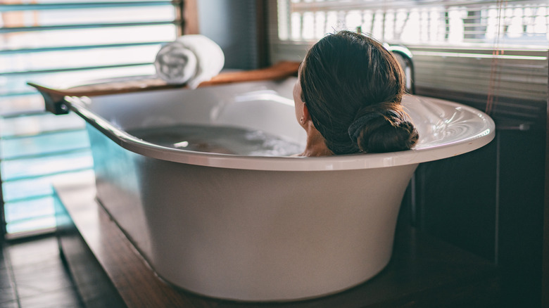 woman soaking in tub