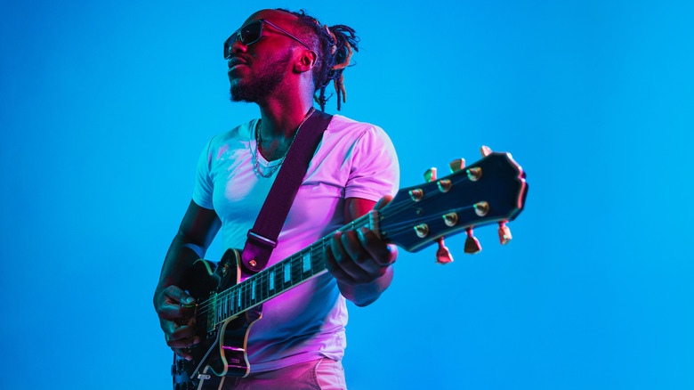 musician playing the guitar