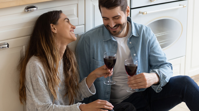 husband and wife drinking wine