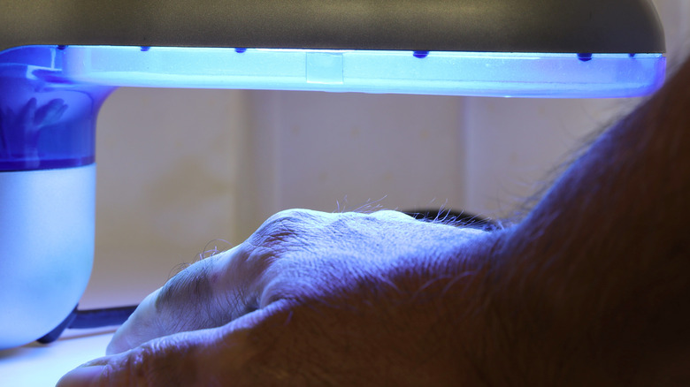 person receiving UV light therapy