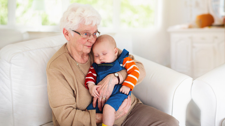 an older woman and newborn baby