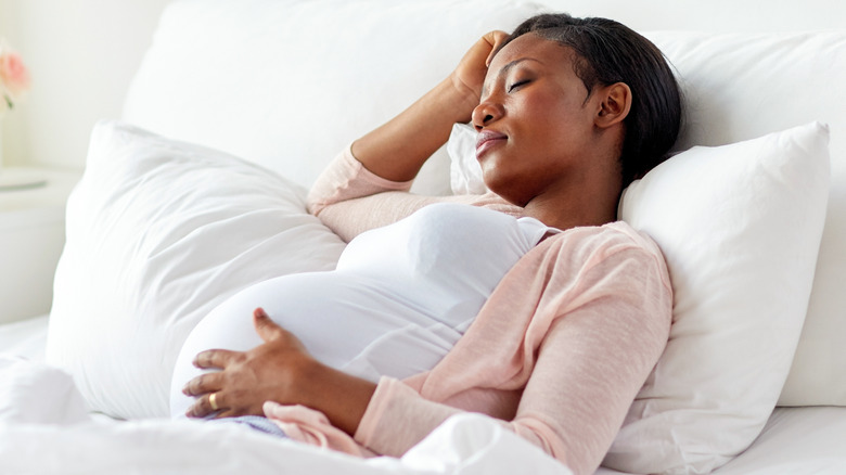african american pregnant woman asleep