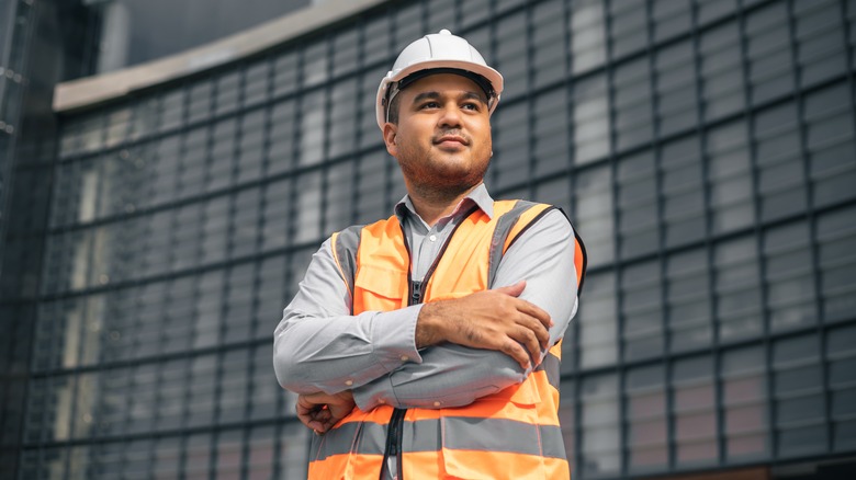 Male construction worker with folded arms
