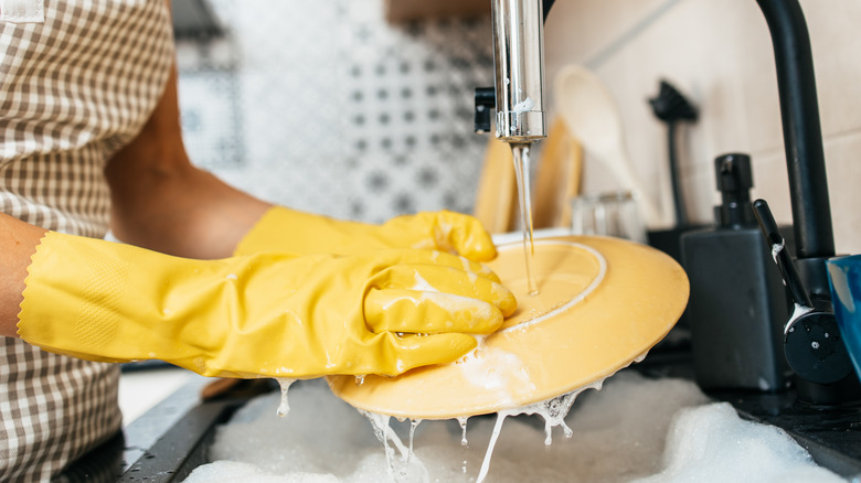 washing dishes with gloves