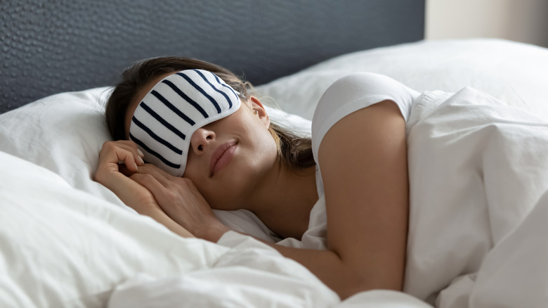 woman sleeping with face mask