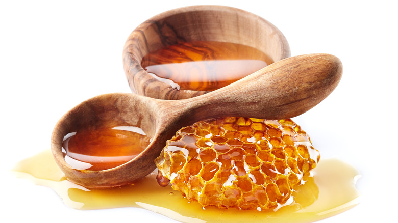 wooden spoon with raw honey