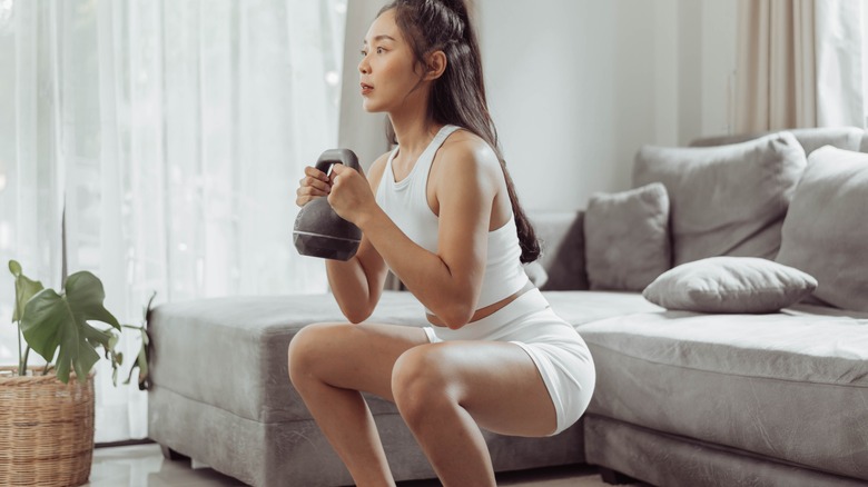 Woman performing goblet squats